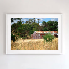 Load image into Gallery viewer, Photographic fine art print, depicting a rusty red Shed, near Yea, Victoria, with white frame. Browse to find a frame and photo combination that suits your decor. 
