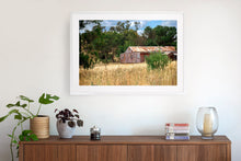 Load image into Gallery viewer, Photographic fine art print, depicting a rusty red Shed, near Yea, Victoria, with white frame. Browse to find a frame and photo combination that suits your decor. 
