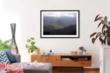 Load image into Gallery viewer, Wall art depicting Mount Buller and black cockatoos. This option shows  an Australian made black frame. 
