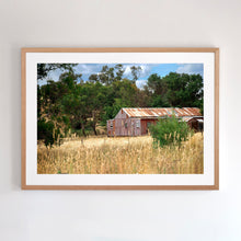 Load image into Gallery viewer, Photographic wall art (fine art print), depicting a rusty red Shed, near Yea, Victoria, with an Australian oak frame. Browse to find a frame and photo combination that suits your decor. 
